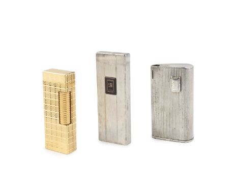 A Dunhill gold plated lighter, of rectangular textured form, 6.5cm high, boxed together with two other lighters, by Maruman a