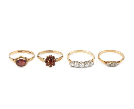 A diamond five stone ring, the slightly graduated round brilliant-cut diamonds in claw settings, stamped '18CT', (two diamond