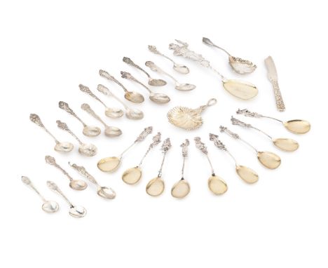 A German silver figural serving spoon, with gilded spot-hammered bowl, and nine matching smaller spoons, all stamped 800, tog