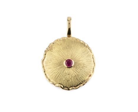 A ruby single stone pendant by KATA Jewellery Ltd, the disc-shaped concave panel centred with a circular mixed-cut ruby to a 