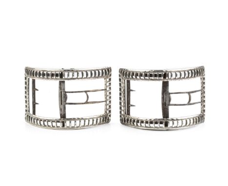A pair of George III silver shoe buckles, of arched rectangular form, the ladder pierced borders with beaded decoration, and 