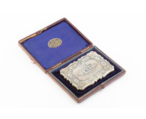 A mid Victorian silver card case, of shaped rectangular form, engraved with stylised foliage and diaperwork, by Deakin &amp; 