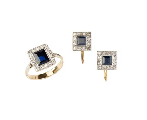 A sapphire and diamond cluster ring, the rectangular step-cut sapphire within a border of millegrain set old-cut diamonds, ab