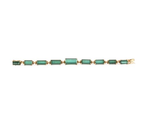 A tourmaline bracelet, designed as a line of graduated rectangular step-cut green tourmalines, with French eagle's head mark 