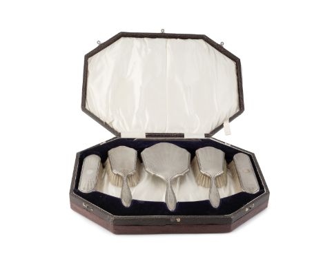 A silver backed six piece dressing table set, with engine turned decoration by Hasset &amp; Harper Ltd, Birmingham 1925, case