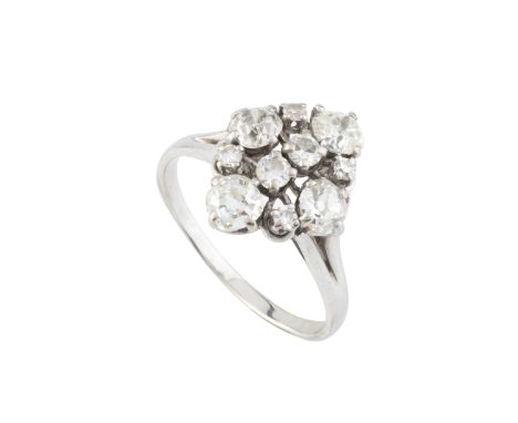 A diamond dress ring, designed as a lozenge-shaped cluster of graduated old, brilliant and single-cut diamonds, between bifur