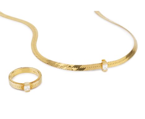 A diamond single stone pendant on chain, the rectangular step-cut diamond in hinged pendant setting, stamped '750 18K', on a 