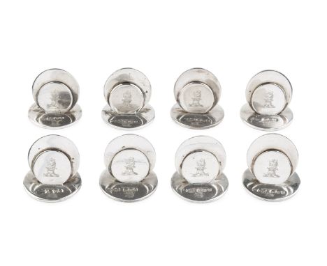 A set of eight Edwardian silver menu holders, of disc form, crested, by Sampson Mordan &amp; Co Ltd, Chester 1903, each 3.5cm