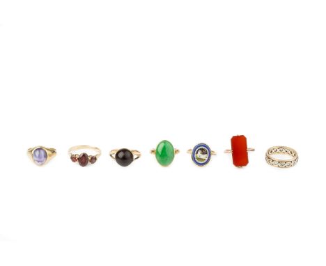 A micromosaic panel ring, the oval panel depicting a dove, stamped '9CT', together with four single stone dress rings, a garn