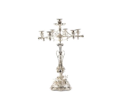 A Victorian silver plated seven light table centrepiece, by Elkington &amp; Co, the shaped foliate and scroll applied column 