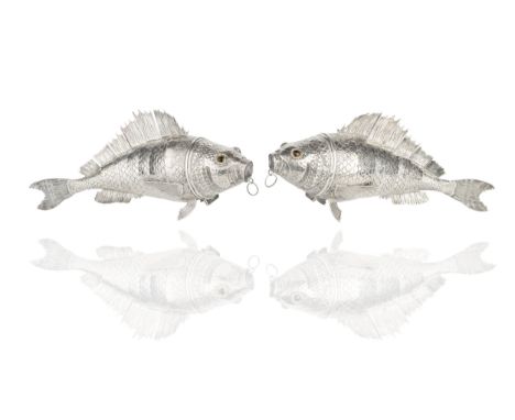 A pair of Continental silver articulated fish table ornaments, with hinged heads and inset glass eyes, and having engraved fi