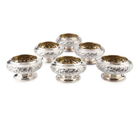 A set of six George IV silver large pedestal salts, each relief decorated with a frieze of stylised oak leaves issuing from a