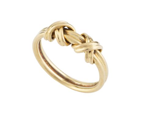 An 18ct gold dress ring by Tiffany &amp; Co., designed as two 'X' motifs on a reeded band, signed and hallmarked for London 2