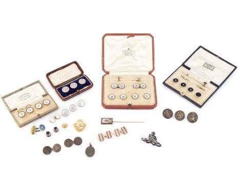 A set of three diamond and enamel buttons, each circular panel millegrain set with old and lasque-cut diamonds, bordered by w