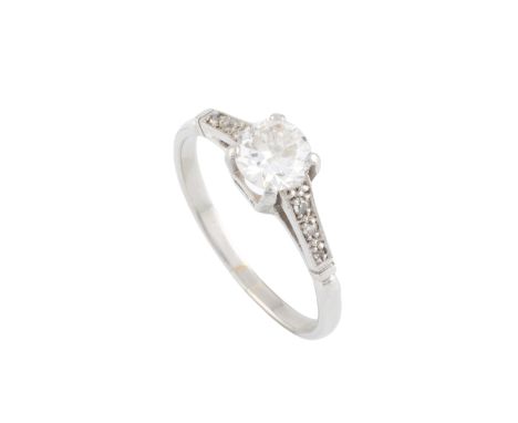 A diamond single stone ring, the old brilliant/transitional-cut diamond in raised four claw setting, between vari-cut diamond