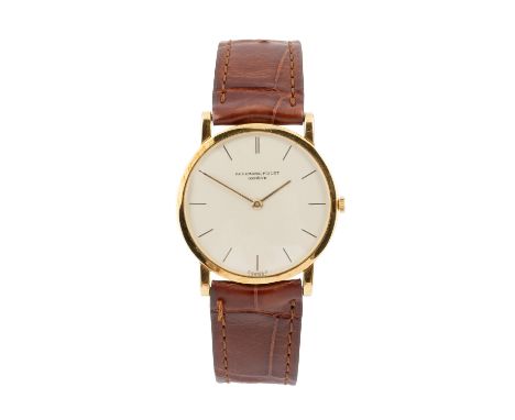 An 18ct gold dress watch by Audemars Piguet, circa 1960, of slimline form, the circular cream dial with baton markers, signed