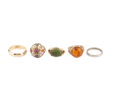 A collection of rings, comprising a green hardstone dress ring, stamped '14K', a 9ct gold mounted amber dress ring, a vari ge