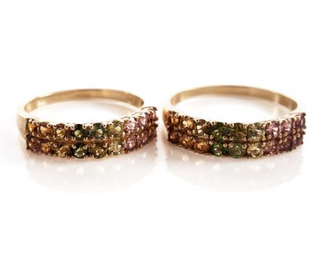 A pair of coloured stone set half hoop eternity rings, in 9ct yellow gold, sizes R and U, 5.3g gross.