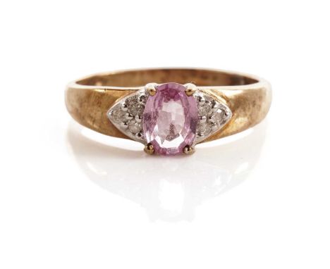 A fancy pink sapphire and diamond dress ring, in yellow metal, size R, 2.1g gross.