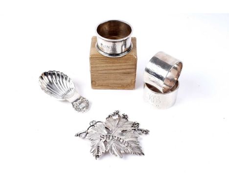 A selection of small silver wares, including: a pair of George V silver napkin rings, by William Base &amp; Sons, Birmingham 