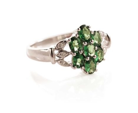 A grossular garnet and diamond flower cluster ring, in 9ct white gold, size R, 3.3g gross.