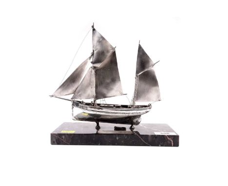 A silver Brixham Trawler "BM27", by Ammonite Ltd, hallmarks indistinct, 4.4oz gross, on marble base with silver name plaque i