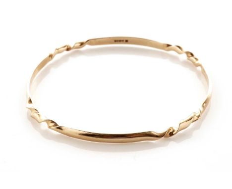 A 9ct yellow gold bangle, of squared circular form, with corners of twist design, 7cms diameter, 9.7g gross.