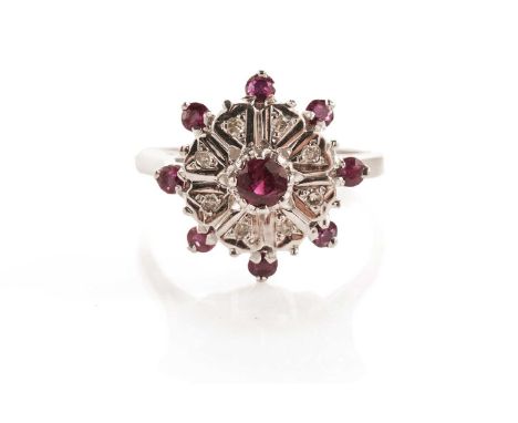 A ruby and diamond cluster ring, in 9ct white gold, size R, 6.7g gross.
