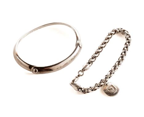 A Georg Jensen "Button" pattern silver bangle, pattern 440, designed by Vivianna Torun Bülow-Hübe, stamps to interior, 7cms w