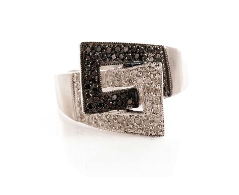 A diamond and black diamond dress ring, of interlinked buckle design, in 9ct white gold, size R, 6.2g gross.