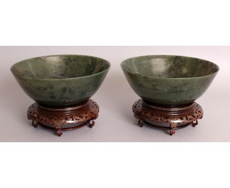 A GOOD LARGE PAIR OF 20TH CENTURY CHINESE SPINACH GREEN JADE BOWLS, together with wire inlaid fitted wood stands and also a f