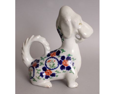 AN UNUSUAL 20TH CENTURY JAPANESE IMARI PORCELAIN MODEL OF A SEATED DOG, 6.3in long & 7in high.