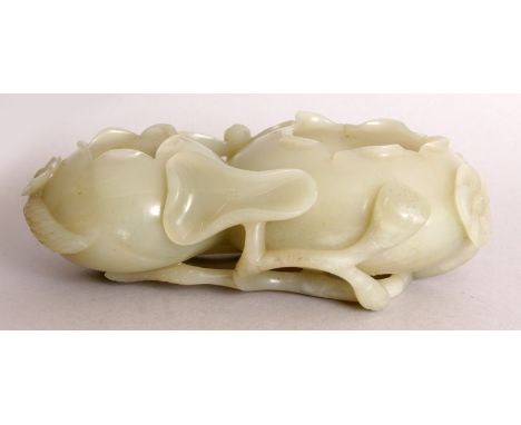 A 19TH/20TH CENTURY CHINESE CELADON JADE LOTUS BUD DOUBLE BRUSHWASHER, the sides decorated in pierced and high relief with a 