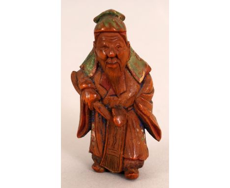 AN UNUSUAL SIGNED JAPANESE MEIJI PERIOD PAINTED WOOD NETSUKE OF A CHINESE SAGE, bearing a ruyi sceptre, the reverse with a re