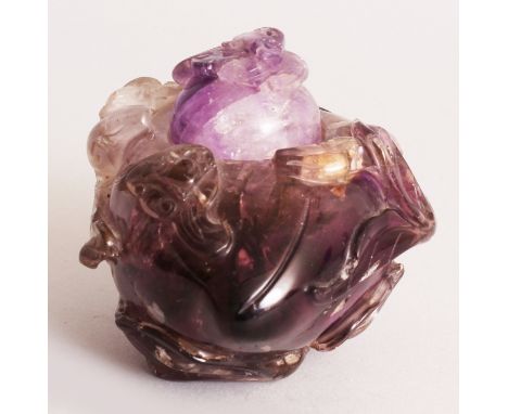 A 19TH CENTURY CHINESE AMETHYST PEACH-FORM CENSER & COVER, the sides carved in high relief with leafy tendrils, the cover car