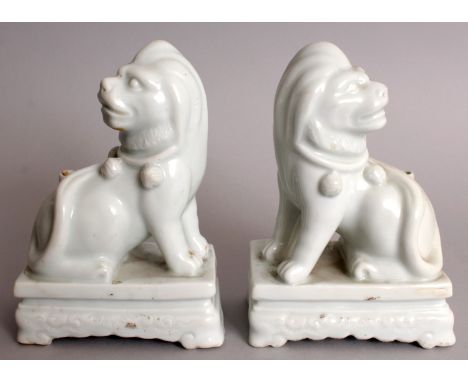 AN UNUSUAL PAIR OF 20TH CENTURY CHINESE BLANC-DE-CHINE PORCELAIN JOSS STICK HOLDERS, in the form of recumbent European style 