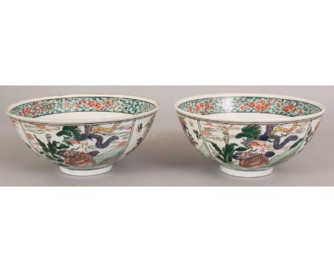 A PAIR OF 19TH/20TH CENTURY CHINESE KANGXI STYLE FAMILLE VERTE PORCELAIN BOWLS, each decorated with panels of mythical animal
