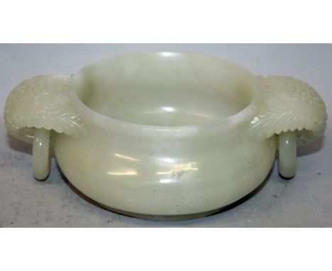 A GOOD QUALITY CHINESE JADE CENSER, with floral carved and loose ring handles, the stone of predominantly pale green tone, 6.