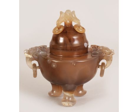 A 19TH/20TH CENTURY CHINESE CARVED AGATE TRIPOD CENSER & COVER, with ring handles, the greyish underlying stone with brown in