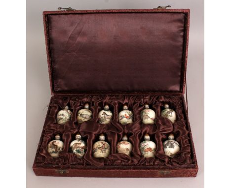 A BOXED SET OF TWELVE CHINESE ANIMAL ZODIAC SNUFF BOTTLES, the base of each snuff bottle with a four-character Qianlong mark,