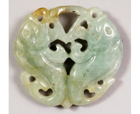 A 20TH CENTURY CHINESE CELADON JADE CARVED & PIERCED DOUBLE CARP PENDANT, the stone with some paler and russet inclusions, 1.