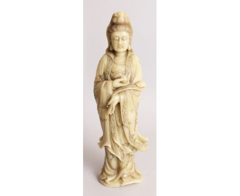 A LARGE GOOD QUALITY 19TH/20TH CENTURY CHINESE SOAPSTONE FIGURE OF GUANYIN, holding a ruyi sceptre and standing in floral and