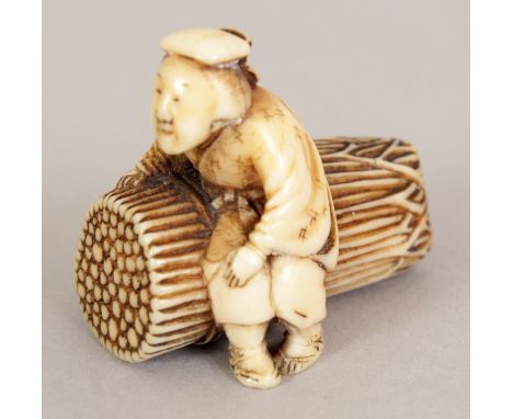 A GOOD QUALITY SIGNED JAPANESE MEIJI PERIOD CARVED IVORY NETSUKE OF AN ELDERLY WOMAN, seated on a rope bound pile of faggots,