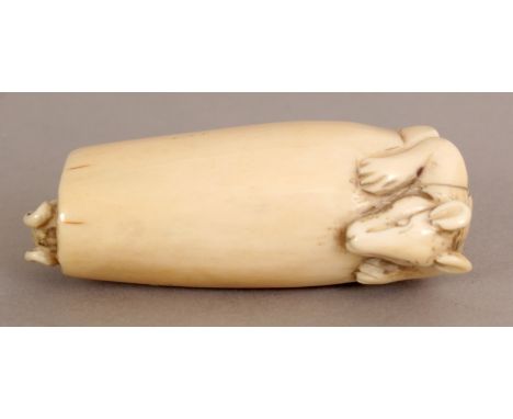 A JAPANESE MEIJI PERIOD IVORY NETSUKE, carved in the form of two rats emerging from each end of a cylinder, 2in long.