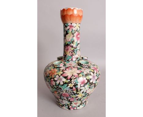 A LATE 19TH CENTURY CHINESE FAMILLE ROSE MILLEFLEUR TULIP VASE, painted with an overall design of overlapping flowers and lea