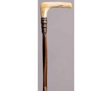 A 19TH CENTURY IVORY & RHINO HORN TWITCH RIDING CROP, the ivory handle above a hallmarked silver collar, the partially spiral