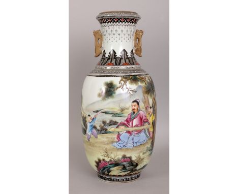 A CHINESE FAMILLE ROSE PORCELAIN VASE, decorated with a seated musician and playing children in a garden setting, the base wi