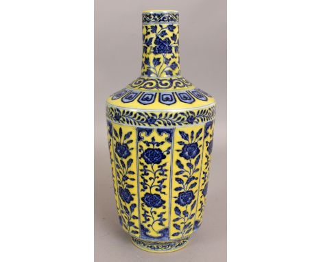 A CHINESE MING STYLE YELLOW GROUND BLUE & WHITE PORCELAIN VASE, the sides slightly moulded with narrow vertical panels of for