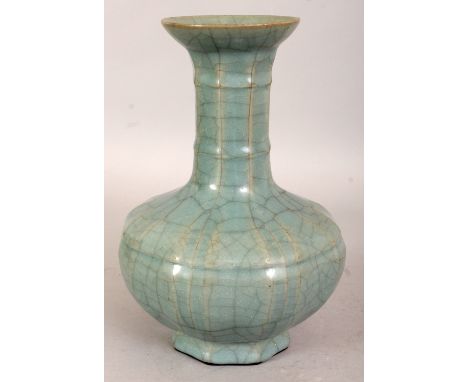 A CHINESE SONG STYLE PORCELAIN VASE, applied with a Guan type glaze, the base with a Qianlong seal mark, 8.4in high.