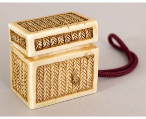 AN UNUSUAL SIGNED JAPANESE MEIJI PERIOD IVORY CORD NETSUKE OF A REED WOVEN RECTANGULAR BOX & COVER, the interior containing t